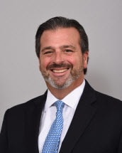 Bio headshot of Christopher D. Buck.