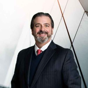 Bio headshot of Christopher D. Buck.