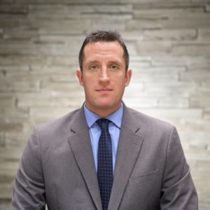 Bio headshot of Joshua T. Nicol.