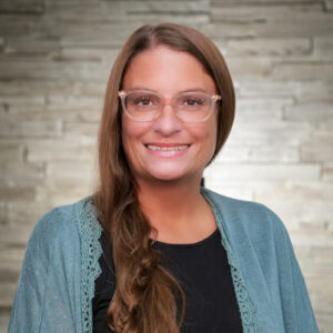 Bio headshot of Jen Fischbach.