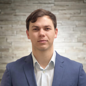 Bio headshot of Reid Burrows.
